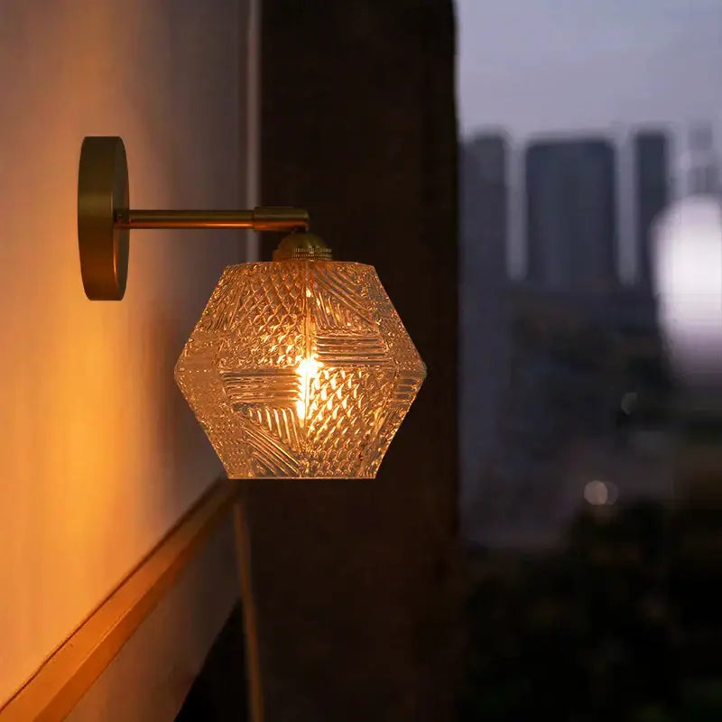 Japanese vintage gold bell glass led wall lamp with brass hexagonal sconce and intricate cut-glass pattern emitting warm light