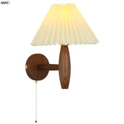 Warm-toned japanese walnut wood cream pvc led wall lamp with pleated fabric shade and brass pull chain for bedroom decorbites cream pvc