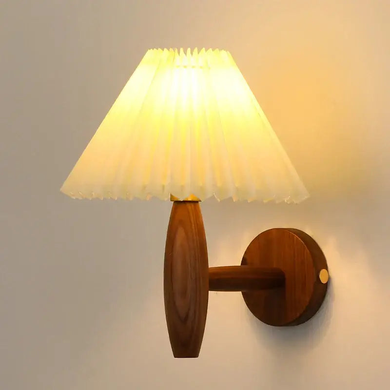 Warm-toned japanese walnut wood wall lamp with pleated cream pvc led shade for bedroom decorbites cream pvc sconce