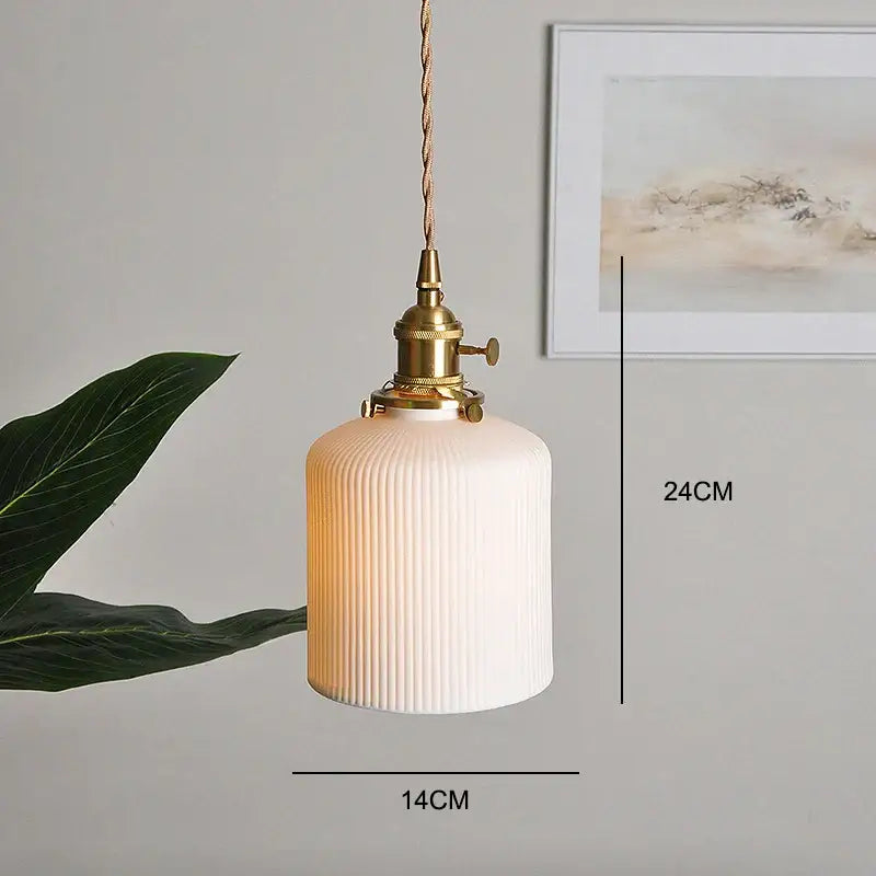 Japanese white fluted ceramic pendant light with a polished copper finish and white ribbed glass shade for kitchen lighting