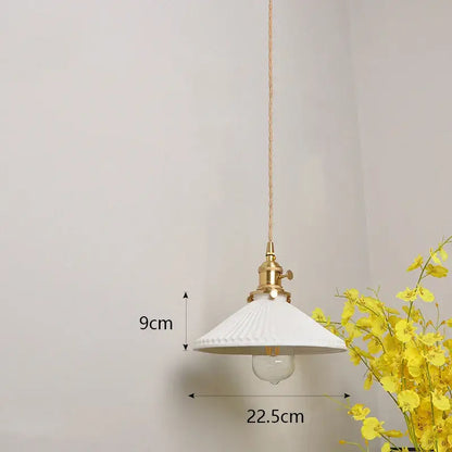 Japanese white fluted ceramic pendant light with polished copper finish metal fixture and braided cord for kitchen lighting