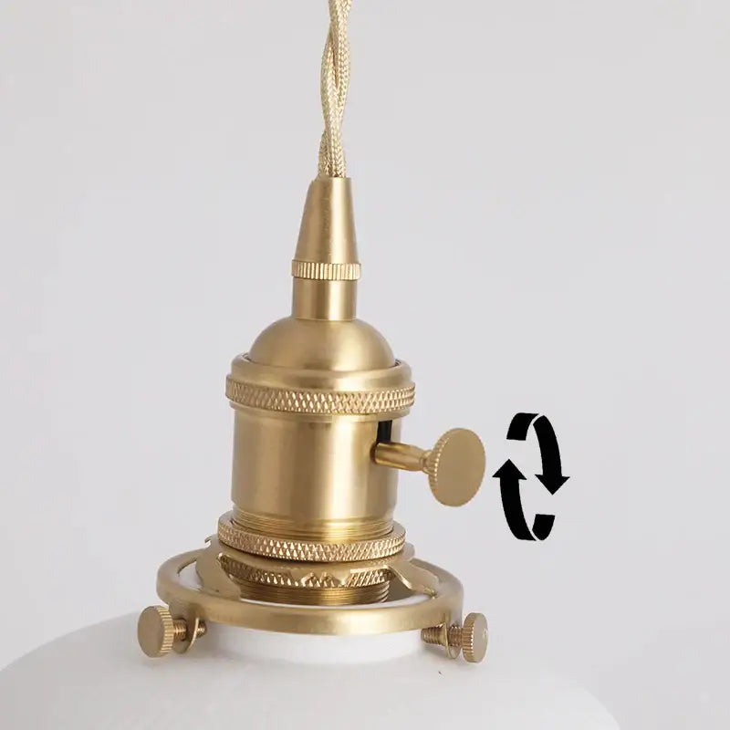 Japanese white fluted ceramic pendant light with polished copper finish and brass-finished socket with braided cord attachment