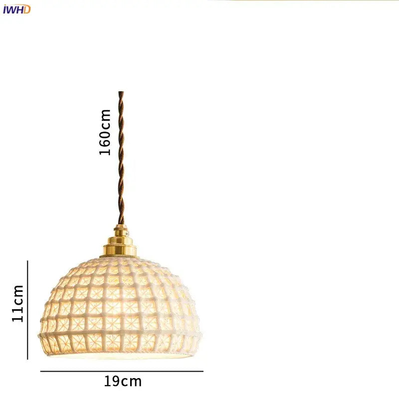 A warm-toned dome-shaped ceramic led pendant light with textured glass shade and brass hardware for dining room decorbites ceramic led