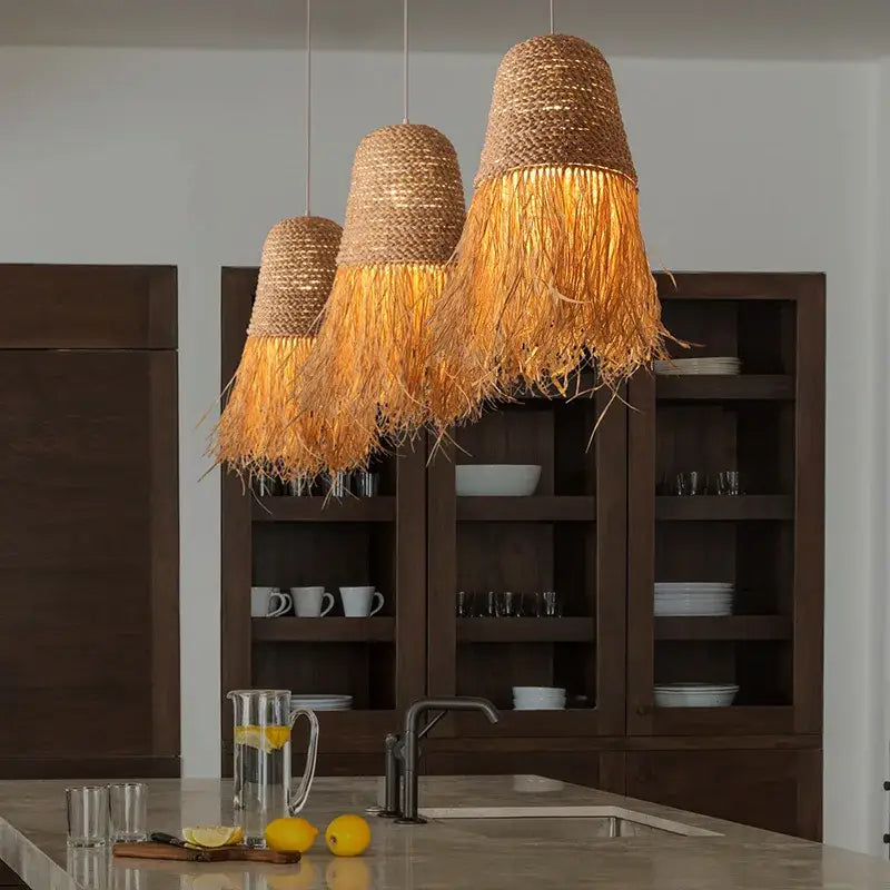 Three hanging decorbites handmade rattan pendant lights with natural-toned woven straw shades and fringe for living room decor
