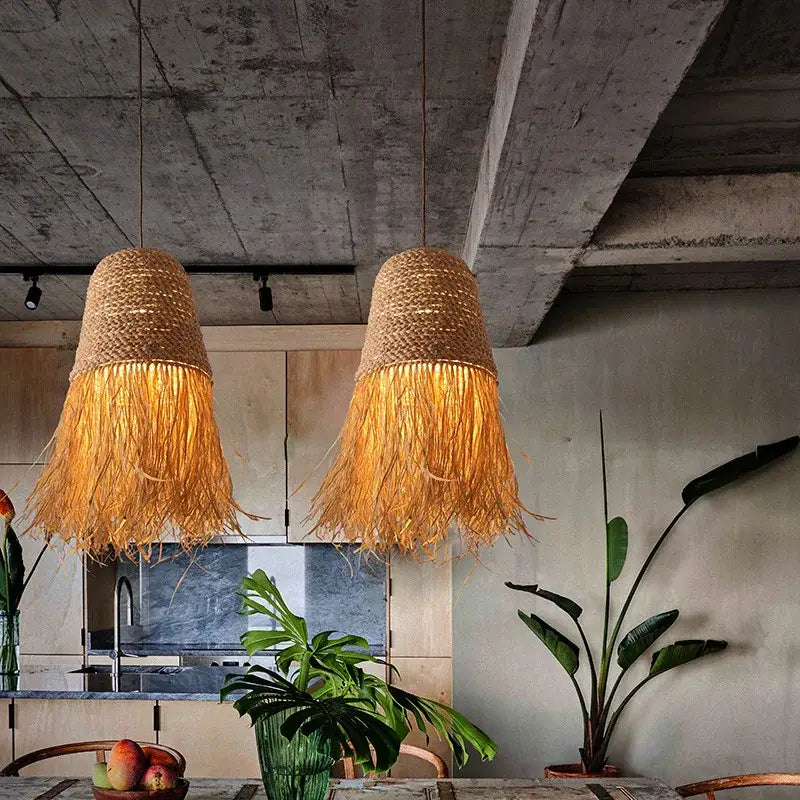 Two golden-brown handmade rattan pendant lights with fringed edges for living room decor by decorbites