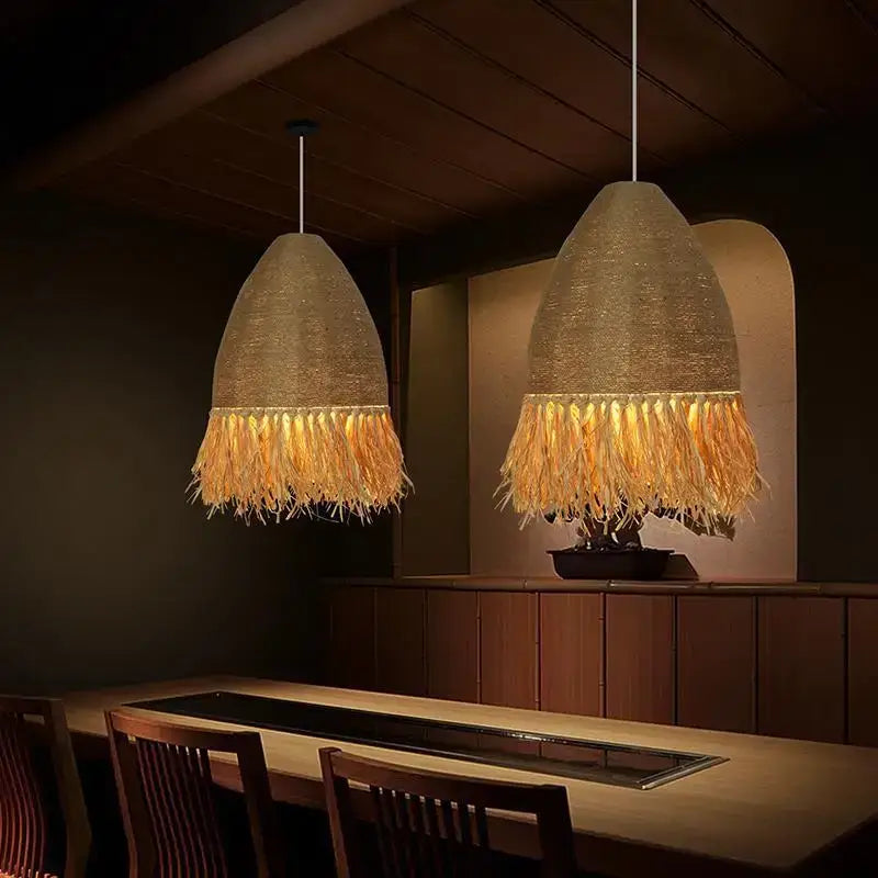 Two warm-toned handmade rattan pendant lights with woven natural fiber shades and fringed tassels for living room decorbites handmade rattan pendant