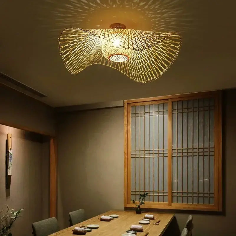 Japanese woven wave bamboo pendant chandelier with intricate radial pattern and warm golden glow for dining room decorbites bamboo pendant