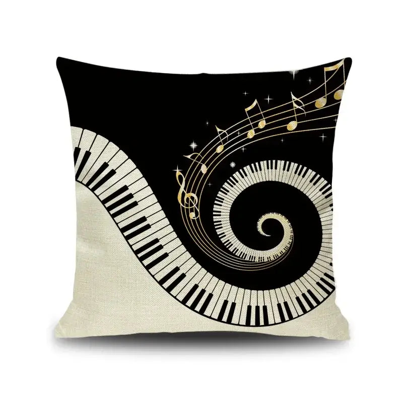 Black and cream linen throw pillow with swirling letter notes piano graphic and gold accents for living room decorbites decor