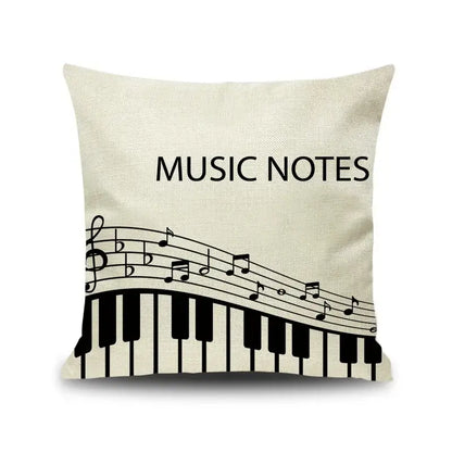 Beige linen throw pillow with black letter notes piano graphic and music notes text for living room decorbites decor