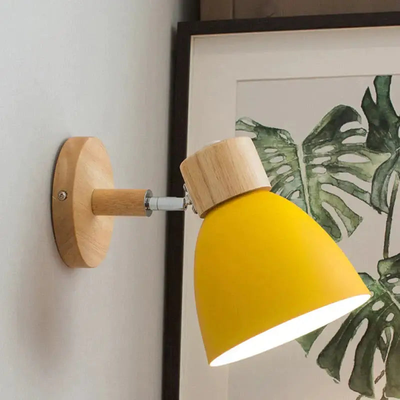 Bright yellow matte joan wooden reading wall lamp with natural wood base and adjustable arm for bedroom lighting
