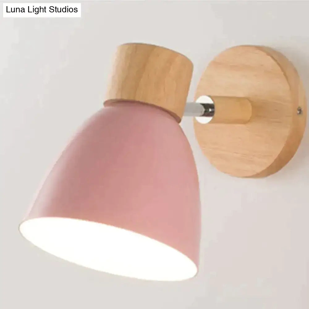 Pink matte-finished metal lamp with natural wood base and mounting plate in joan wooden reading wall lamp design