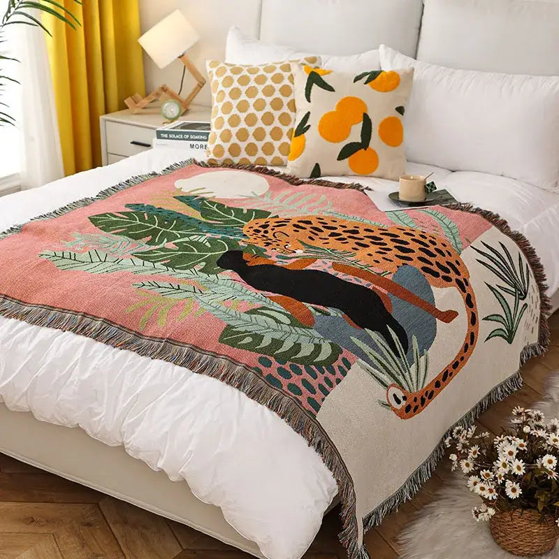 Cozy pink and cream leopard print throw blanket with vibrant jungle scene and fringed edges for bedroom decorbites decor