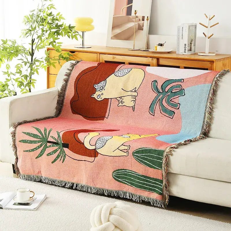 Pastel pink leopard print throw blanket with whimsical cartoon cats cactus design and fringed edges for bedroom decorbites decor