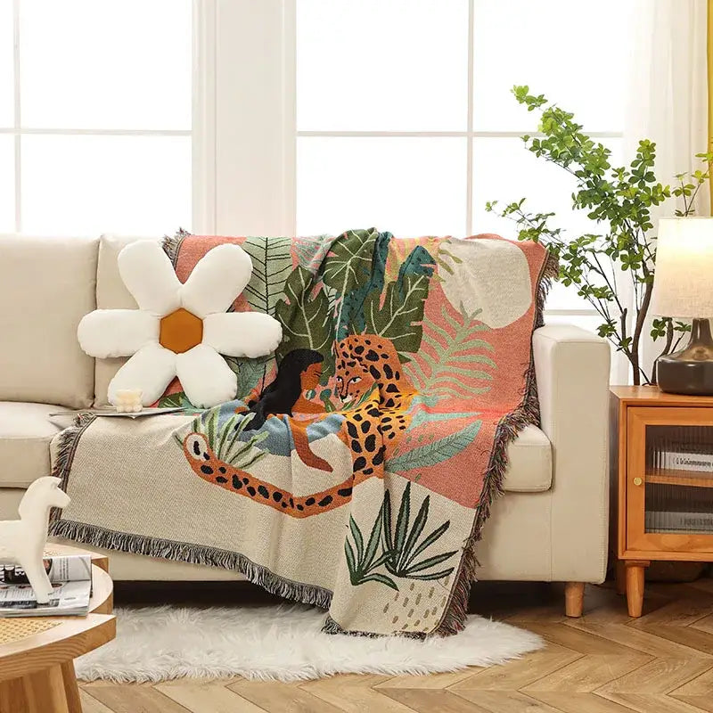 Cozy woven beige jungle pink and cream leopard print throw blanket with vibrant orange and black leopard decorbites leopard print