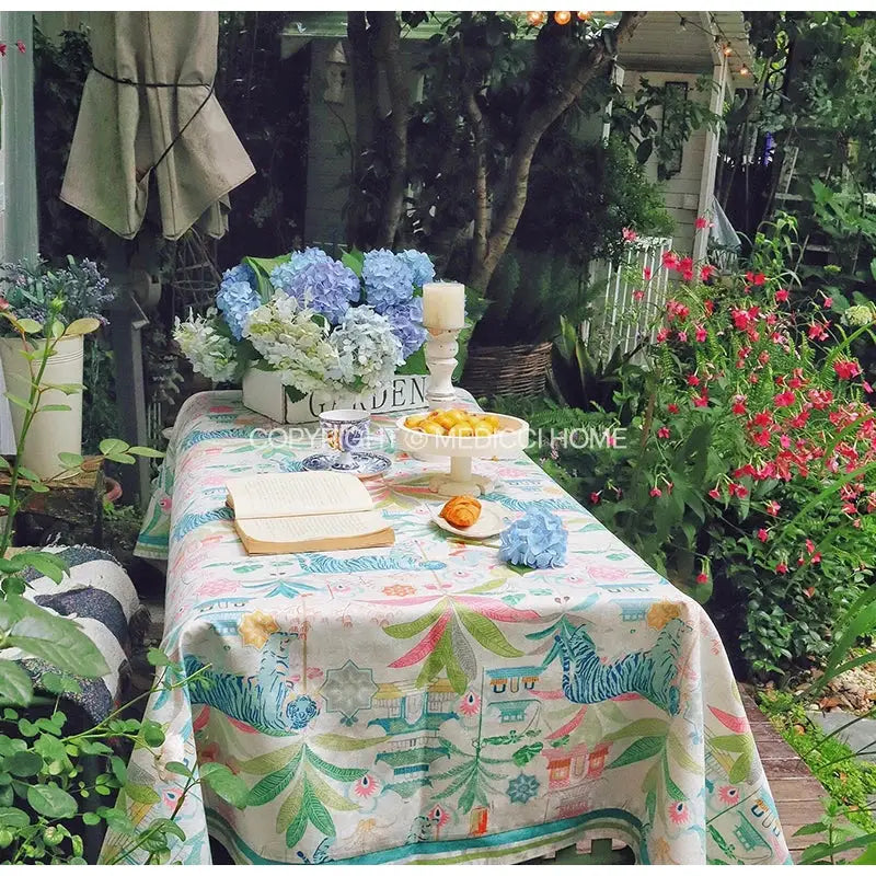 Jungle vibes tablecloth cream with teal and green tiger print featuring whimsical foliage for kitchen decor by decorbites jungle