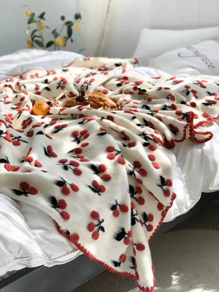 A cozy cream and red cherry kids wool blanket with fleece and crocheted border for kawaii bedroom decorbites 3d cherry