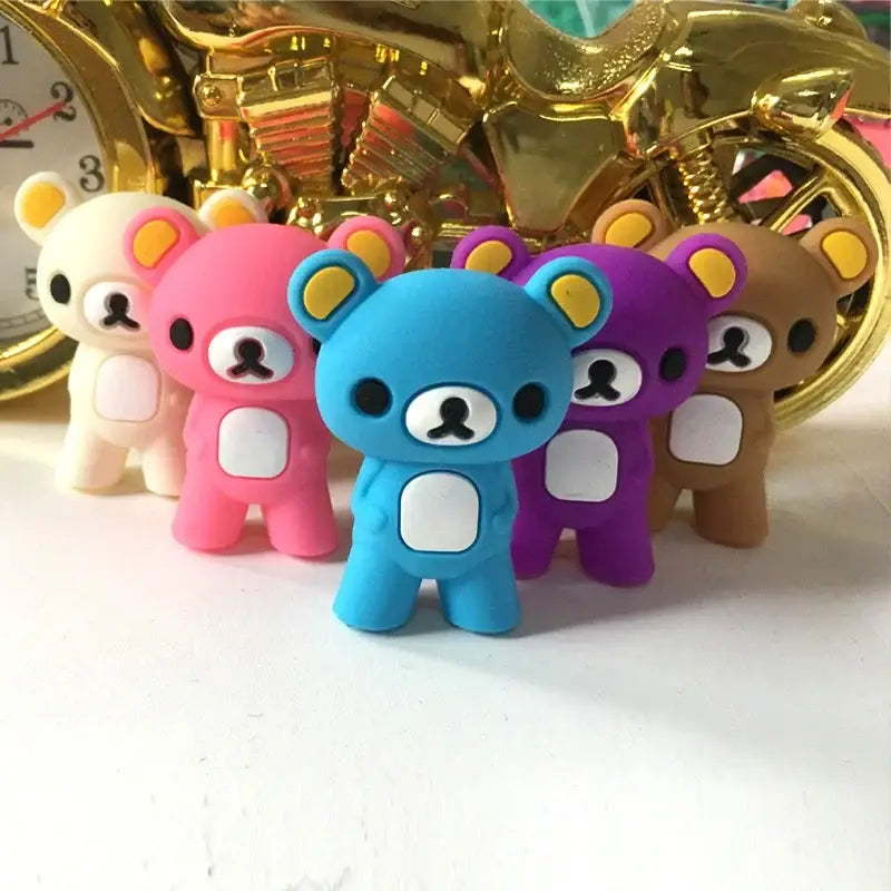 A collection of colorful plush rilakkuma bear-shaped usb flash drives in pink blue purple and brown for decorbites kids bear panda cat gift sets