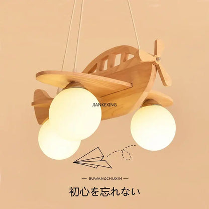 Kids wood airplane pendant light with three frosted glass bulbs in a wooden decorbites kids wood airplane design