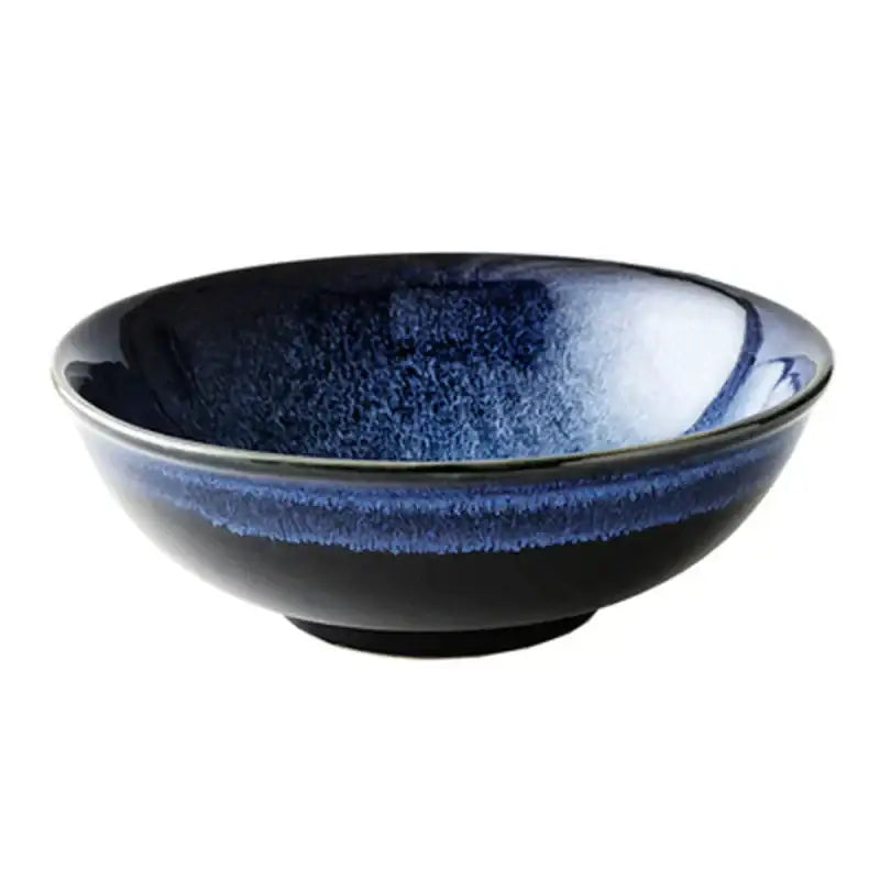 A kiln glazed ceramic bowl with blue speckled gradient glaze ideal for dining room ramen dishes from decorbites kiln glazed