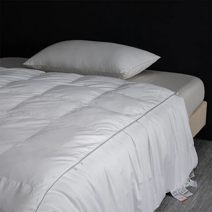 White quilted king size goose down and silk duvet set with smooth satin finish and subtle edge stitching