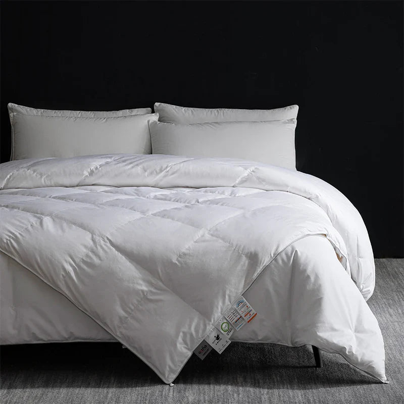 White quilted king size goose down and silk duvet set with soft plush texture and subtle stitching patterns
