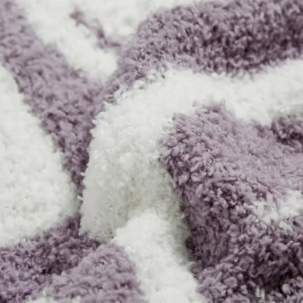 A plush decorbites knitted checkboard smile face gray and white blanket with lavender and white soft texture for bedroom throw