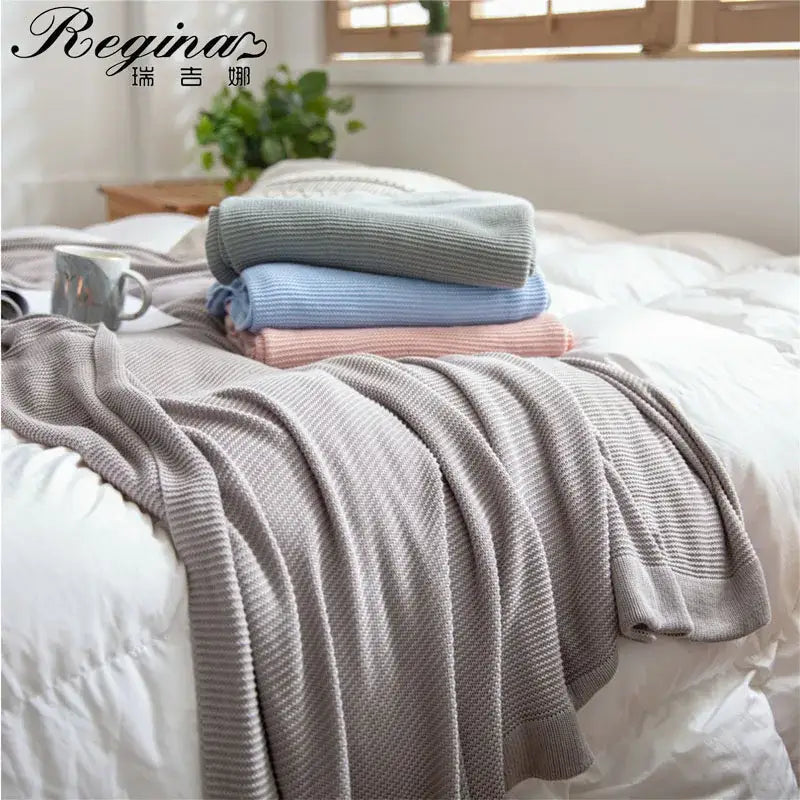 Gray ribbed knit throw blanket with soft textured weave designed as a bamboo cooling throw for bedroom bedding