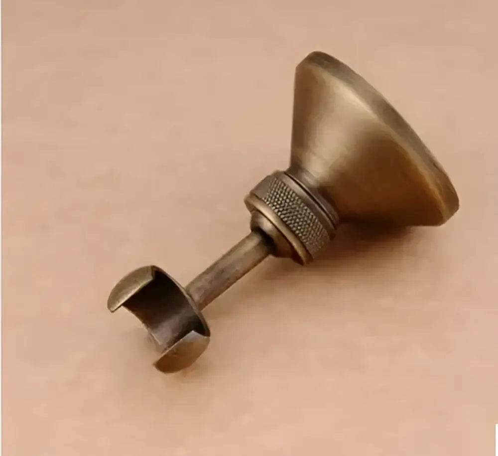 Antique brass knurled shower head holder with textured grip ring and flared top for wall mount bathroom use