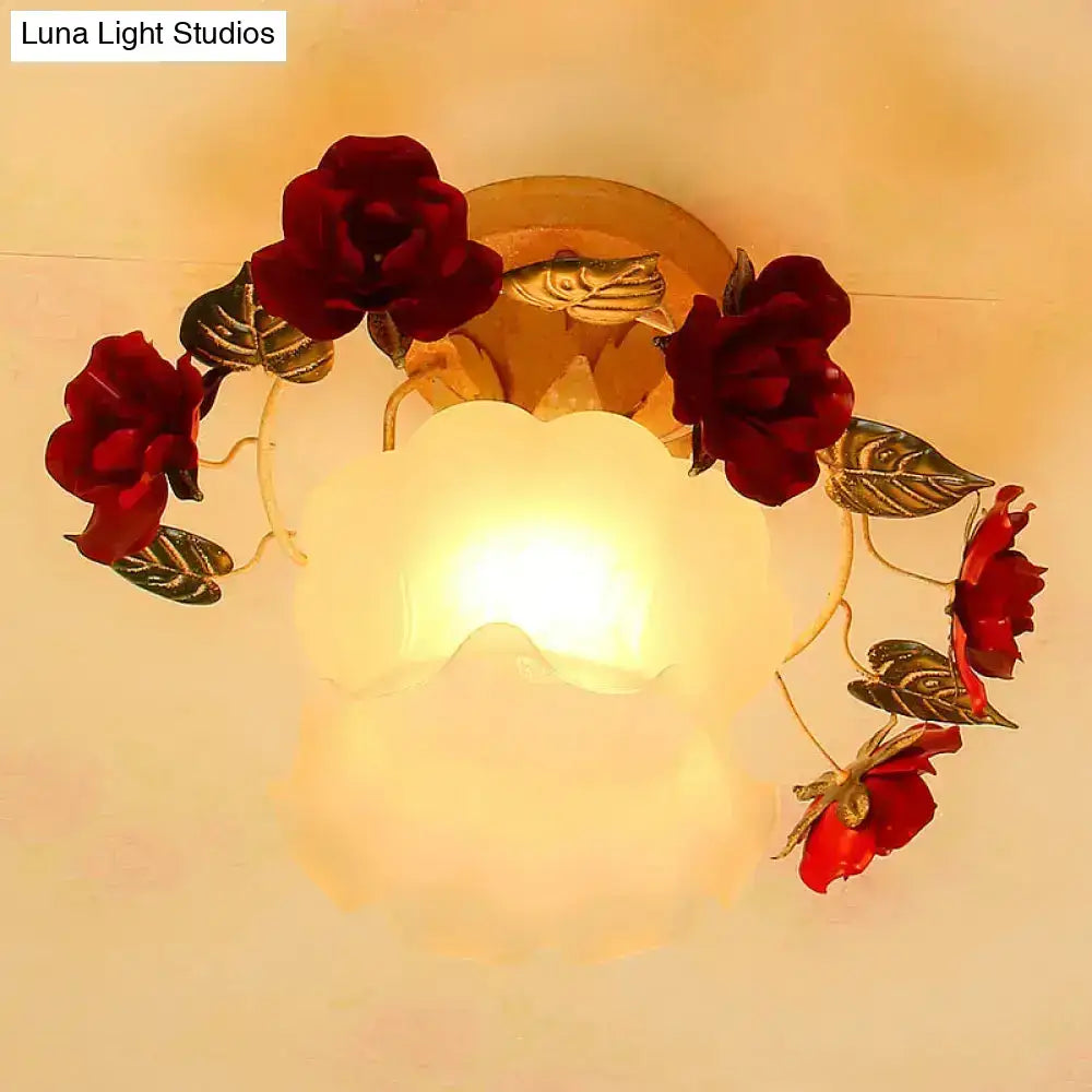 A warm glowing frost white glass ceiling light with korean garden ruffle design featuring red roses and gold leaves