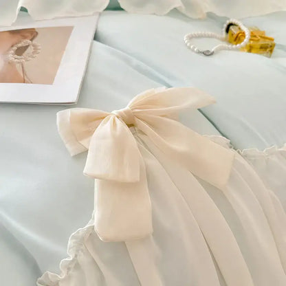 Cream-colored satin korean lace bow on blue and cream bedding set for elegant decorbites korean lace bedroom decor