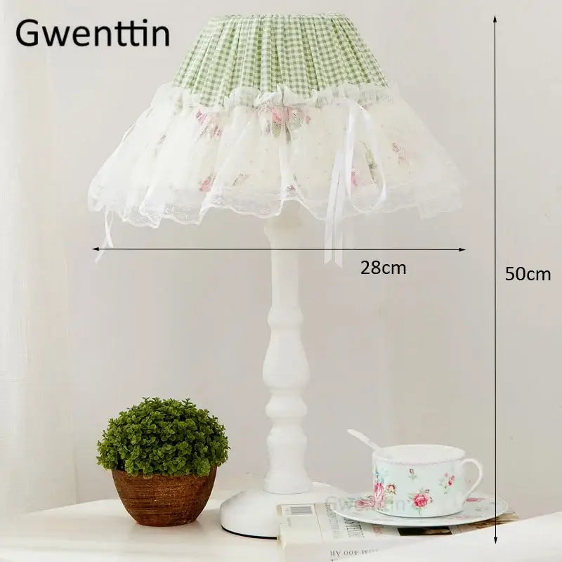 A delicate white table lamp with a green and white gingham top and floral lace trim by decorbites korean lace princess