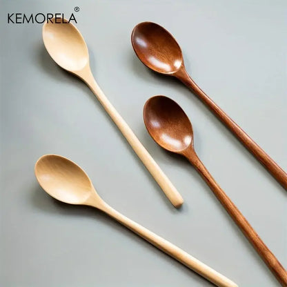 Set of four kemorela wooden spoons in natural and medium brown finishes with smooth minimalist design for dining