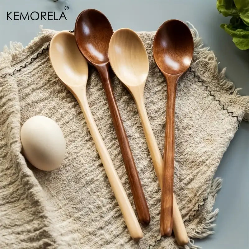 Set of four kemorela wooden spoon set in natural and dark brown finishes with smooth handcrafted surfaces