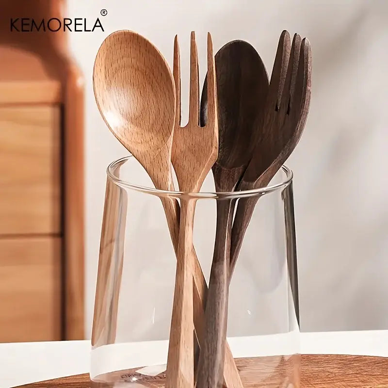 Set of Korean style natural wooden fork and spoon set in natural and dark wood finishes displayed in a glass container