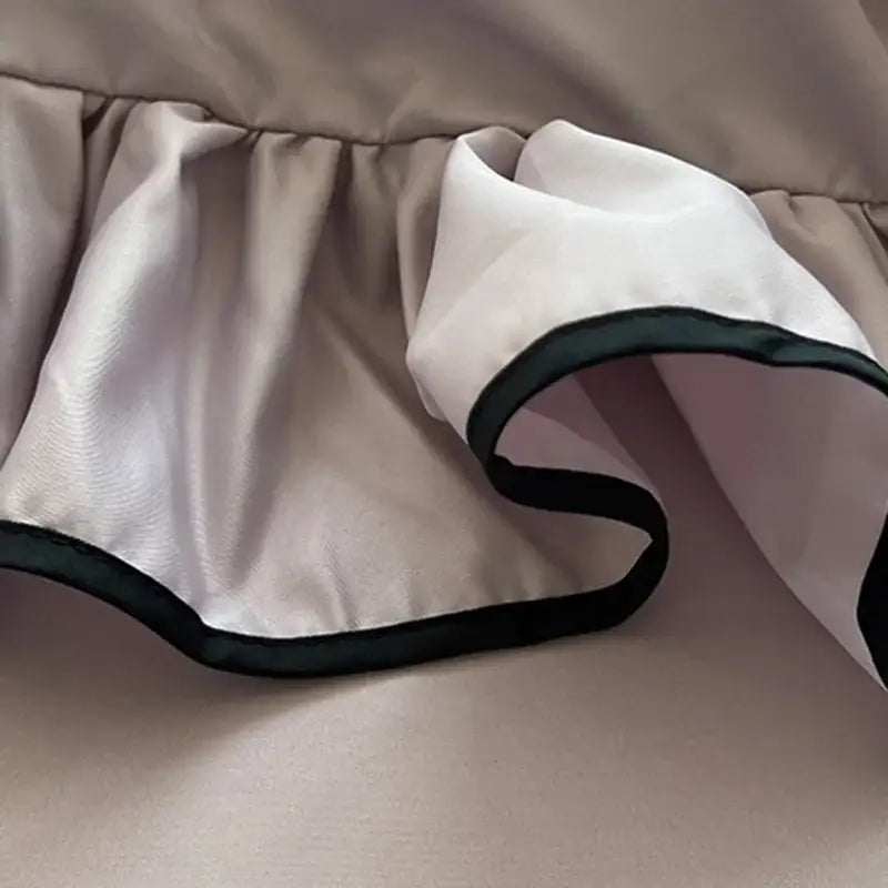Beige satin ruffle with black trim on lavender and black cooling silky ruffled bedding set for elegant bedroom decorbites decor