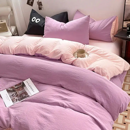 Soft lavender cotton bedding set with duvet and pillowcases plus black accent pillow with white cartoon eyes