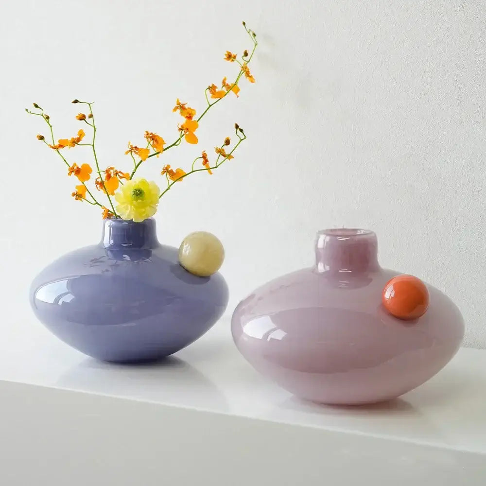 Two pastel ceramic vases in lavender and blush pink with spherical accents for decorbites geometric glass vase decor