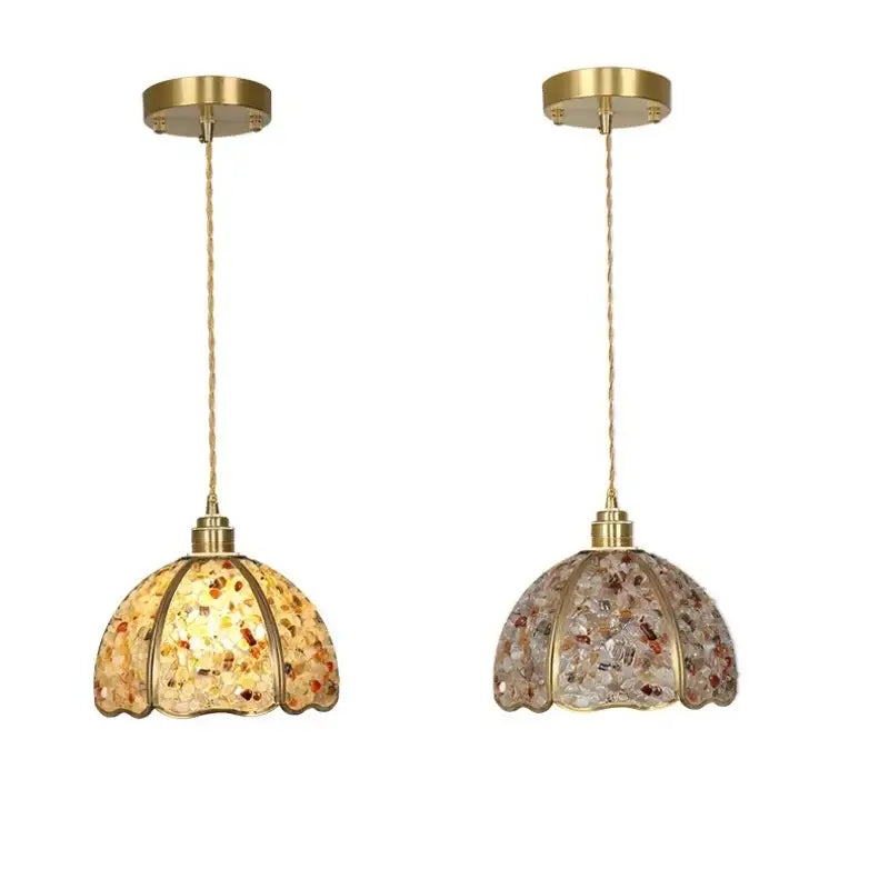 Two elegant pendant lights with brass fixtures and mosaic decorbites crystal glass led shades in amber and earthy tones