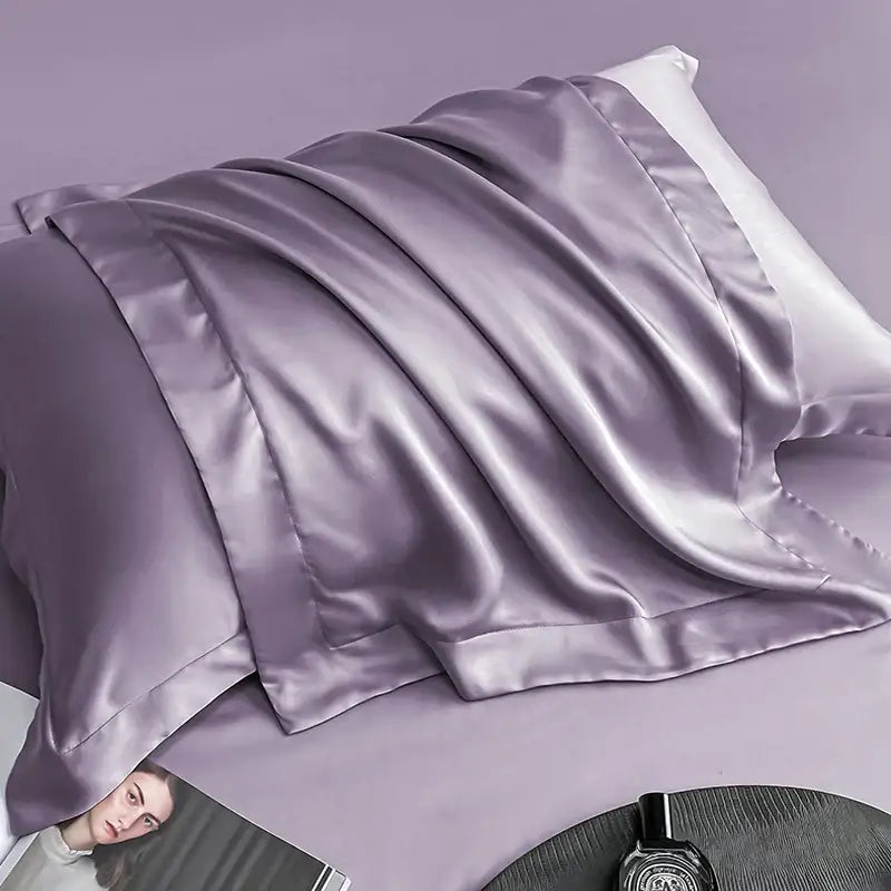 A luxurious lavender egyptian cotton pillowcase with a smooth glossy satin finish in a cotton pillowcase set