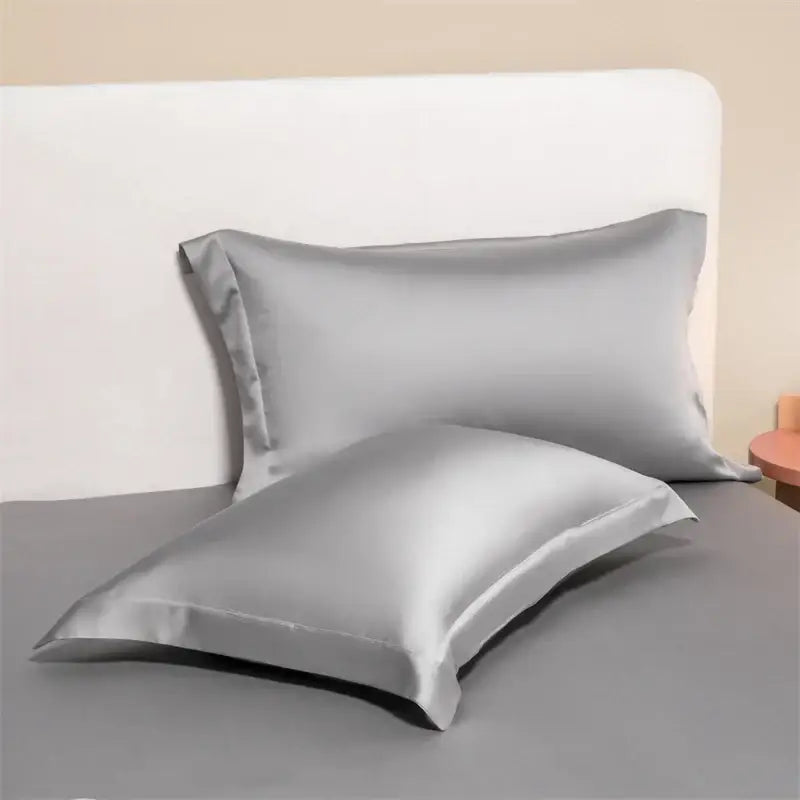 Silver satin pillowcases with a smooth glossy finish from a lavender egyptian cotton pillowcase set for bedroom bedding covers