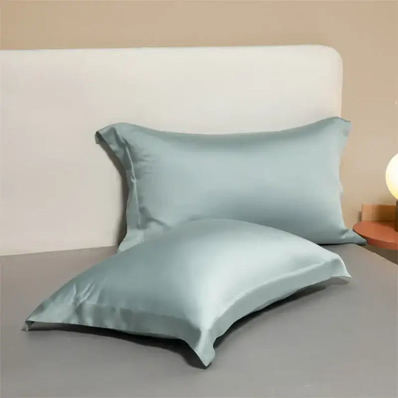 Two light blue satin egyptian cotton pillowcases with smooth glossy finish from lavender cotton pillowcase set