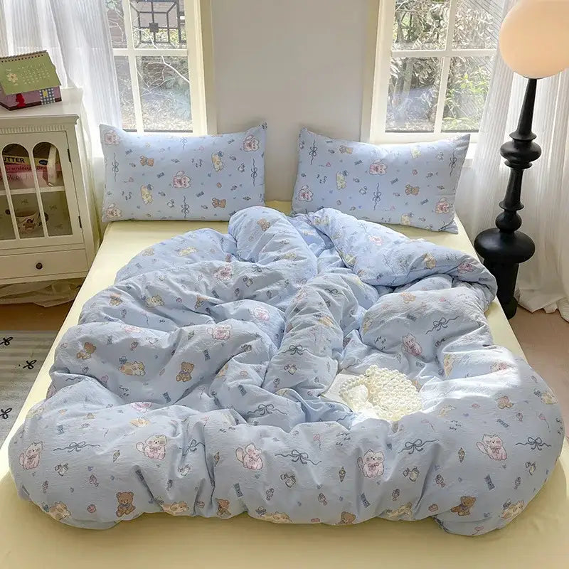 Light blue cotton bedding set with plush texture and pastel pink brown cartoon animals in lavender floral design