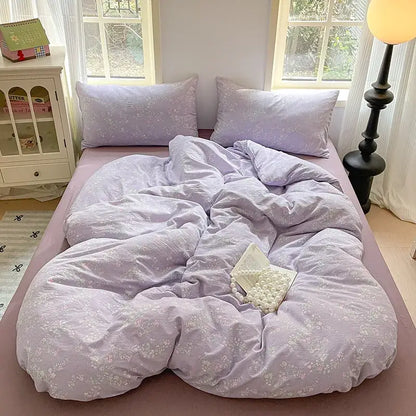 Lavender floral textured cotton bedding set with soft fabric and matching pillows for a cozy bedroom quilt