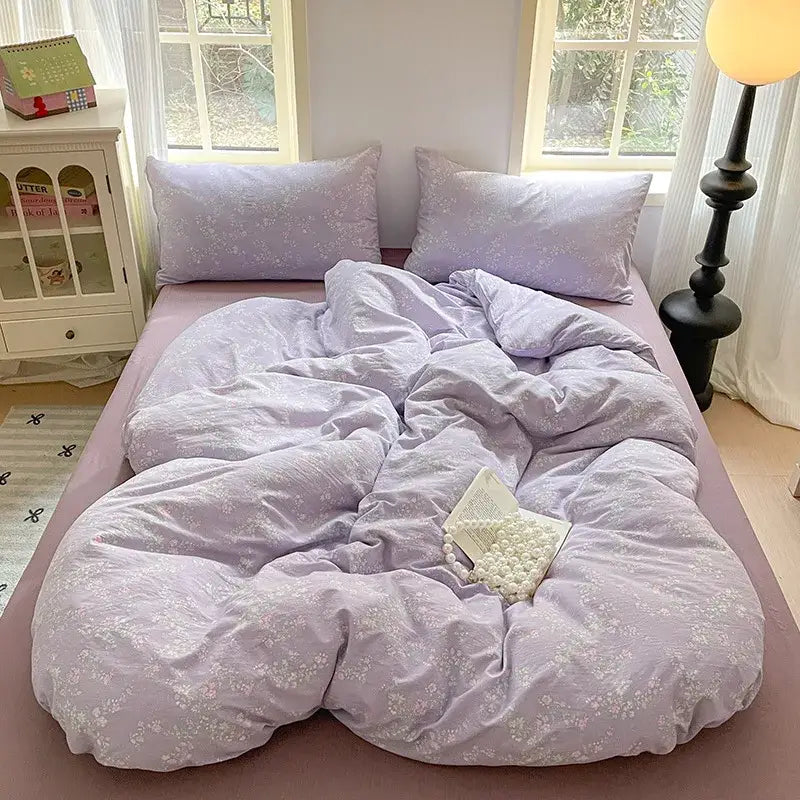 Lavender floral textured cotton bedding set with soft fabric and matching pillows for a cozy bedroom quilt