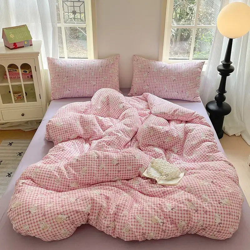 Pink gingham cotton bedding set with small white cartoon animal prints ideal for a bedroom quilt use