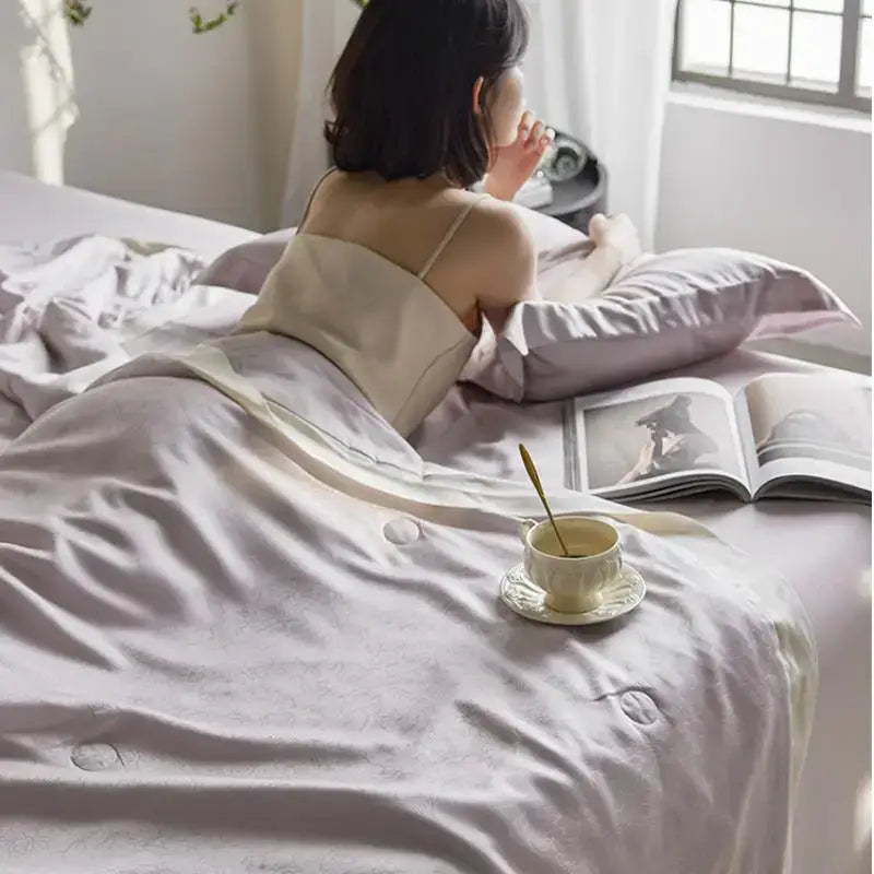 A soft lavender satin quilt set with subtle quilted jacquard detailing and matching pillowcase for light luxury decorbites bedding