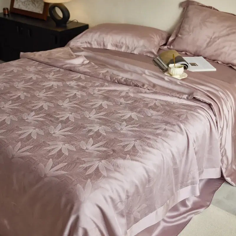 Lavender jacquard quilt set featuring a soft rose-gold satin duvet cover with subtle bamboo leaf pattern decorbites light luxury