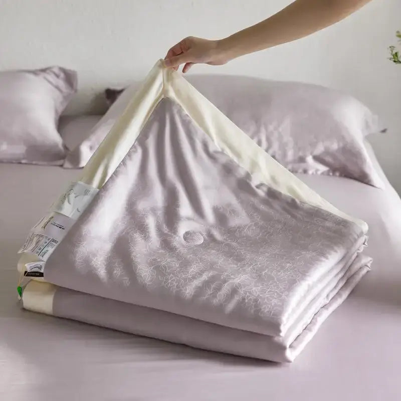 Soft lavender satin duvet cover with subtle floral pattern and cream inner lining in decorbites light luxury jacquard quilt set