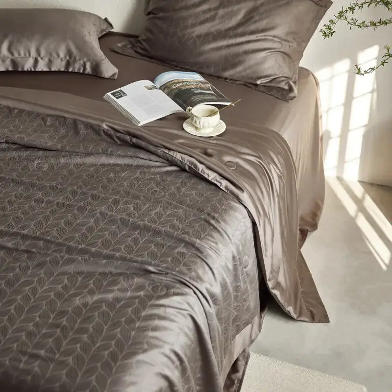 Lavender jacquard quilt set featuring a metallic taupe satin duvet cover with subtle leaf pattern for decorbites light luxury bedding
