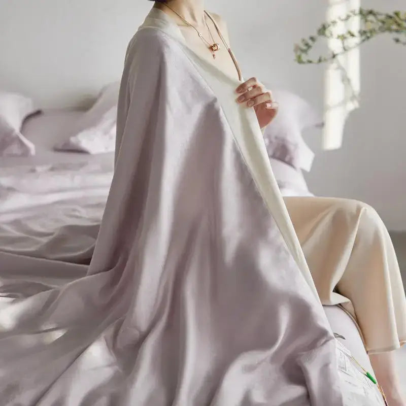 A soft lavender silk robe with flowing draped design and subtle sheen complements decorbites light luxury jacquard quilt set
